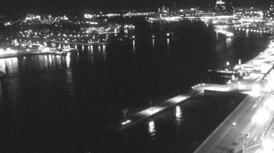 Amsterdam harbour at night, city lights reflected in water