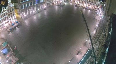 Brussels Grand Place at 4 AM — enormous empty cobblestoned square, ornate guild houses lit around the perimeter, no people