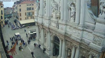 Venice campo near Santa Maria del Giglio church, baroque facade, gondola station, crowds milling at street level